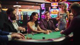 Group,Of,Diverse,Poker,Players,Sitting,At,A,Table,As