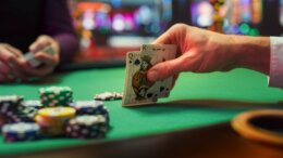 Close,Up,Shot,On,Hand,Of,Anonymous,Poker,Player,Checking